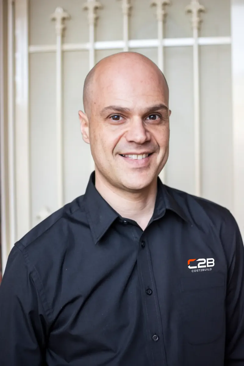 Cost2Build founder in branded shirt